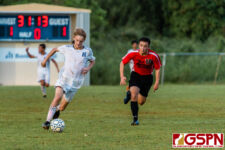 HCA Eagle Levi Buckwalter gets a clean touch on a through ball for a shot at goal. (Photo by Michael Blas