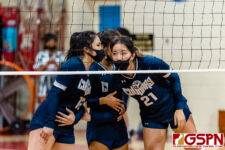 AOLG Cougars Sadie Gutierrez, Sophia Kelly, and Gabriella Mata talk strategy in the closing minutes of the game. (Photo by Michael Blas)