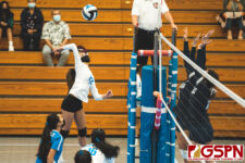ND Royal Jaeana Lizama loads up for a spike against the Cougar middle blockers. (Photo by Michael Blas)