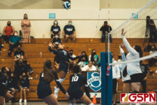 AOLG Cougar Genice Torres leaps for a kill against the ND Royal middle blockers. (Photo by Michael Blas)