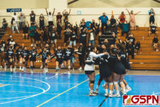 The AOLG Cougars and fans celebrate after defeating the ND Royals in the fifth set to be crowned champions. (Photo by Michael Blas)