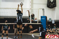 JFK Islander Alessandra Pagdilao sends the ball over SSHS Shark Sadie Tumanda. (Photo by Michael Blas)