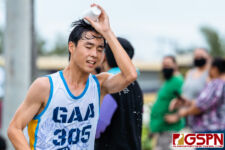 GAA Angel Samuel Jung dumps water as he closes out the first half of the race. (Photo by Michael Blas)