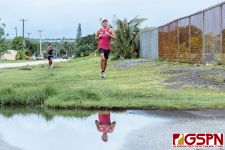 OHS Bulldog Jone Gimoto leads the race in the final leg. (Photo by Michael Blas)