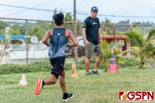 SSHS Sharks Coach Jin Han pushes his team in the final stretch of the race. (Photo by Michael Blas)