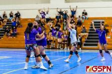 The GW Geckos celebrate as they continue to extend their lead in the final set. (Photo by Michael Blas)