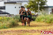 JFK Islander Landon Taitingfong leads the top pack out of the jungle portion of the race. (Photo by Michael Blas)