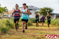 Runners make their way through the rough terrain after exiting the jungle portion of the race. (Photo by Michael Blas)