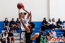 HCA Eagle Alex Oralles takes a shot against JFK Islander Karl Vinca. (Photo by Michael Blas)