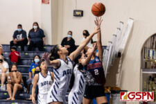OHS Bulldog Jasmine Samson goes in for a lay up against AOLG Cougar Mia Taitano. (Photo by Michael Blas)