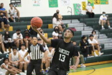 Shark Jerfick Aunu gets the teams first two points on the day after a steal. (photo by Robert Balajadia)
