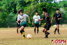 JFK Islander Andrew Choe goes on the attack against SSHS Shark Elmer Punzalan. (Photo by Michael Blas)