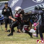 Team Legacy Jalana Garcia gets away from the defense for extra yardage. (photo by Bout It Productions)