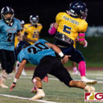 Guam High Panther Jalen Thach spins off Dolphins Dean Caldwell for a huge kick off return. (Photo by Michael Blas)