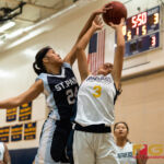 St. Paul Warriors Niah Siguenza gets a block on Guam High Panthers Alexia Brown. (Photo by Michael Blas)