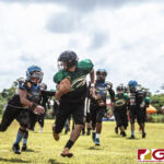 Guam Packers Ethan Cruz gets past the defender and finds the end zone. (photo by Bout It Productions)
