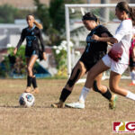 St. Paul Warriors Tiffani Lopez and Knights Kaia Malakooti press up for possession. (Photo by Michael Blas)