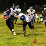Simon Sanchez Sharks Kamerin Toves stiff arms Guam High Panthers Jeylyn Dowdell. (Photo by Michael Blas)