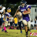 George Washington Geckos Trystan Guerrero reacts quickly to a bad snap and runs down the sidelines to score a two point conversion. (Photo by Michael Blas)