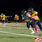 Guam High Panther Andra Johnson completes the reception and spirnts down the sideline. (Photo by Michael Blas)