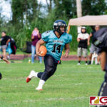 Southern Dolphins Thomas Benavente brings the ball up on the kick return to open the game. (Photo by Michael Blas)