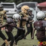 Guahan Eagles Mackenzy "Mackryder4" Sablan powers through the Barrigada Crusaders defense for the two point conversion. (photo by Bout It Productions)