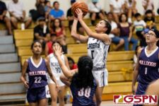 Academy Cougar Cori-Nicole Paulino flies down the middle for two points in the second quarter of the game. (Photo by Michael Blas)