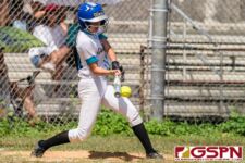 Southern Dolphin Kaleah Duenas connects with the ball to get onto first base. (Photo by Michael Blas)