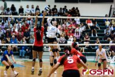 ND Royal Gia Camacho on a spike while Knights Jadyn Palomares attempts to block. (Photo by Michael Blas)