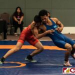 Guams Gavin Whitt in red and Jun Asebias from the FSM start strong in the first round of their bout in the 2019 United Word Wrestling Oceania Championship help at Leo Palace on Sunday April 21, 2019. (Photo by Michael Blas)