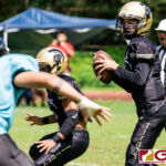 Tiyan Titan QB Kaekoa Leon Guerrero takes the snap and looks for an open receiver. (Photo by Michael Blas)