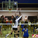 Guam High Panthers Ashley Dill gets both hands to defend against Notre
Dame Royals Gia Camacho. (photo by Bout It Productions)