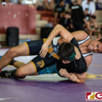 High School wrestlers hit the mats in a Preseason Tournament held at the FD Jungle. (photo by Bout It Productions.)