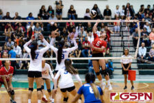 St. John's Knight Tylee Shepherd gets up for a spike in the third set of the game. (Photo by Michael Blas)
