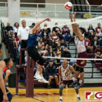 Okkodo Bulldogs Aydan Abad sends the ball flying over FD Friars Logan Pangelinan. (Photo by Michael Blas)