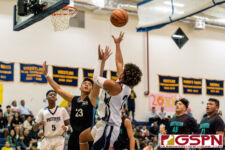 Guam High Panther Trevon Jacobs takes a fade away two pointer while Southern Dolphin LV Ortega contests. (Photo by Michael Blas)