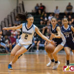 St. Paul Warriors Janniliese Quintanilla snatches the ball, adding to her record of steals. (Photo by Michael Blas)