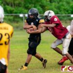 The Simon Sanchez Sharks run a couple of plays during practice in preparation for the 2019 IIAAG High School Football Season. (Photo by Michael Blas)