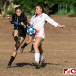 St. John's Knights Tylee Shepherd marks up on Warriors Janniliese Quintanilla. (Photo by Michael Blas)
