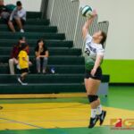 Islander's Kiyoni Yamaguchi serves to Knights at the IIAAG girls high school volleyball game. (Photo by Michael Blas)