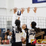 George Washington Geckos Bonita Castro goes in for a spike while St. Paul Warriors Niah Siguenza and Janniliese Quintanilla leap up to block. (Photo by Michael Blas)