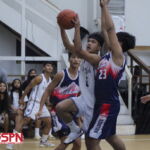 St. Paul Warrior Xander Sanchez goes through the Bulldog defense for his second basket of the game. (photo by Robert Balajadia)
