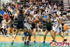 Okkodo Bulldog D'shanae Cruz attacks the basket through the Warrior defense. (Photo by Michael Blas)