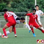 Maldives Hamza Mohamed grabs ahold of Guam Matao Captain Jason Cunliffe as he pursues the ball. (Photo by Michael Blas)