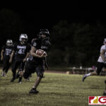 Simon Sanchez Sharks Aiden Lumba glances at GSPN's photographer Michael Ebio before taking it to the house for another touchdown score. (photo by Bout It Productions)