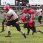 The Bulldogs get good yards on a pass play late in the 4th quarter to get to the Dolphin's 30. (photo by Robert Balajadia)