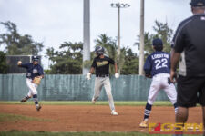 JFK Islanders Allen Blend tries to sneak bases but eventually gets caught. ( Photo by Bout It Productions )