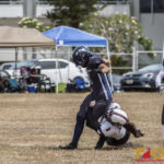 Team Legacy's Olivia Elliot does what it takes to get the tackle by dragging down Island Stunnerz Tiffanie Rodrigues the unconventional way. (photo by Bout It Productions)