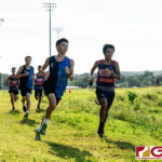 St. Paul Warrior Jacob Miranda and Okkodo Bulldogs Dorion Ren lead the pack early into the IIAAG Cross Country meet. (Photo by Michael Blas)