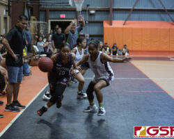 The BMS Roadrunners tie for first place by defeating The Untalan Wildcats in the GDOE Middle School Basketball League. (photo by Bout It Productions)